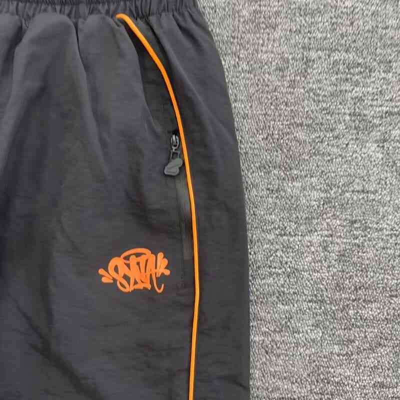 Conjunto Synaworld 'Syna Logo' Shell Black/Orange