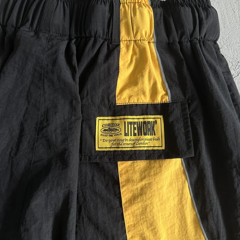 Shorts Corteiz Preto Amarelo